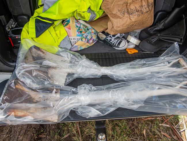 Two shovels were found in dense bush off Great Alpine Road and put into plastic evidence bags. Picture: Jason Edwards