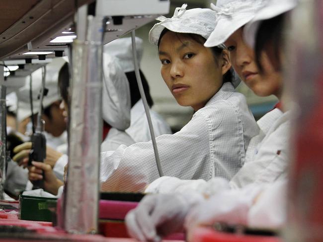 Workers inside a Foxconn factory in the township of Longhua in the southern Guangdong province in this file photo. PHOTO: REUTERS