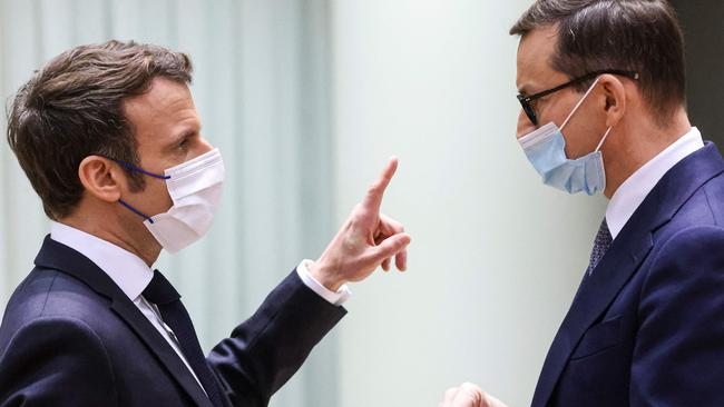 French President Emmanuel Macron (L) and Polish Prime Minister Mateusz Morawiecki at a European Union leaders extraordinary summit to discuss the crisis between Russia and Ukraine, in Brussels. Picture: YVES HERMAN / AFP