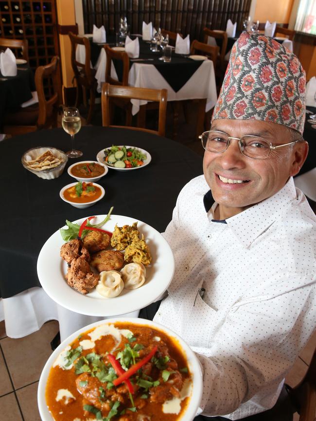 Taste of Nepal owner Kashi Poudel with their Himalayan Banquet. Picture: Stephen Laffer