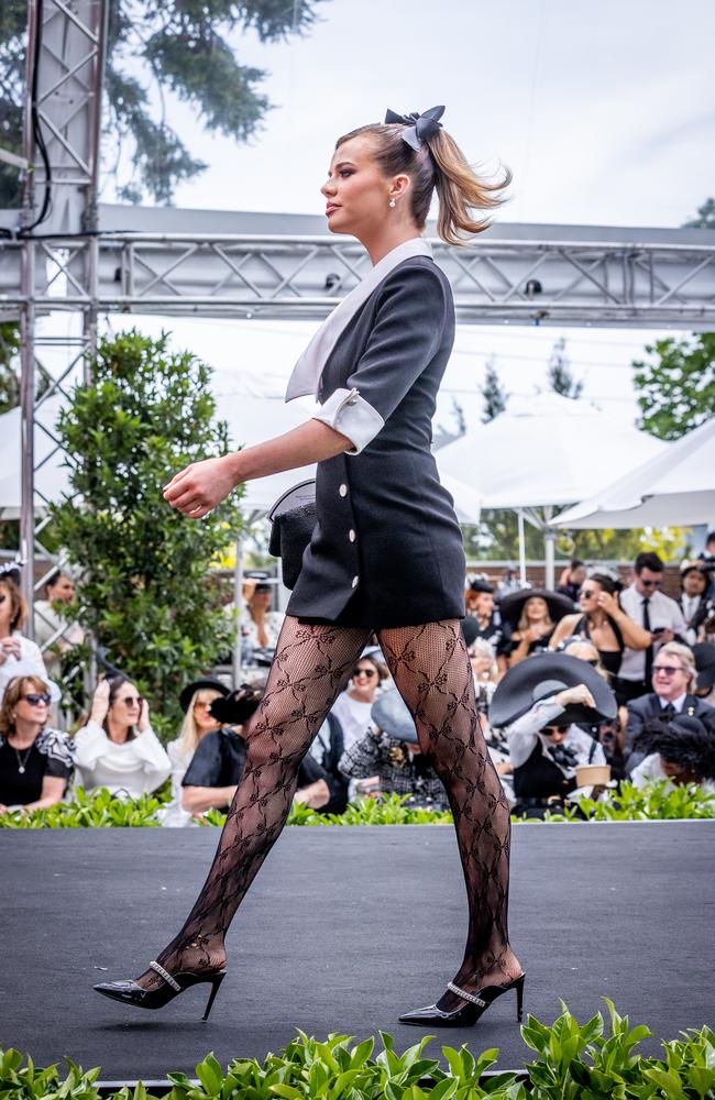 Contestants on the catwalk during Fashions on the Field. Picture: Jake Nowakowski