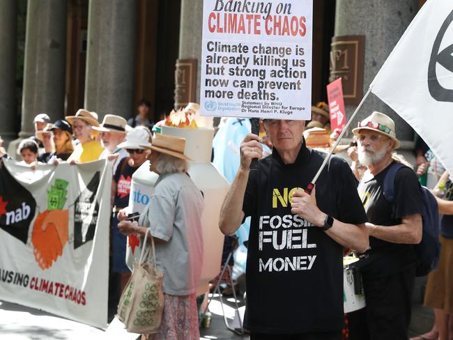 15/12/23: Climate protesters outside the NAB Annual General Meeting at the Fullerton in Sydney. John Feder/The Australian.