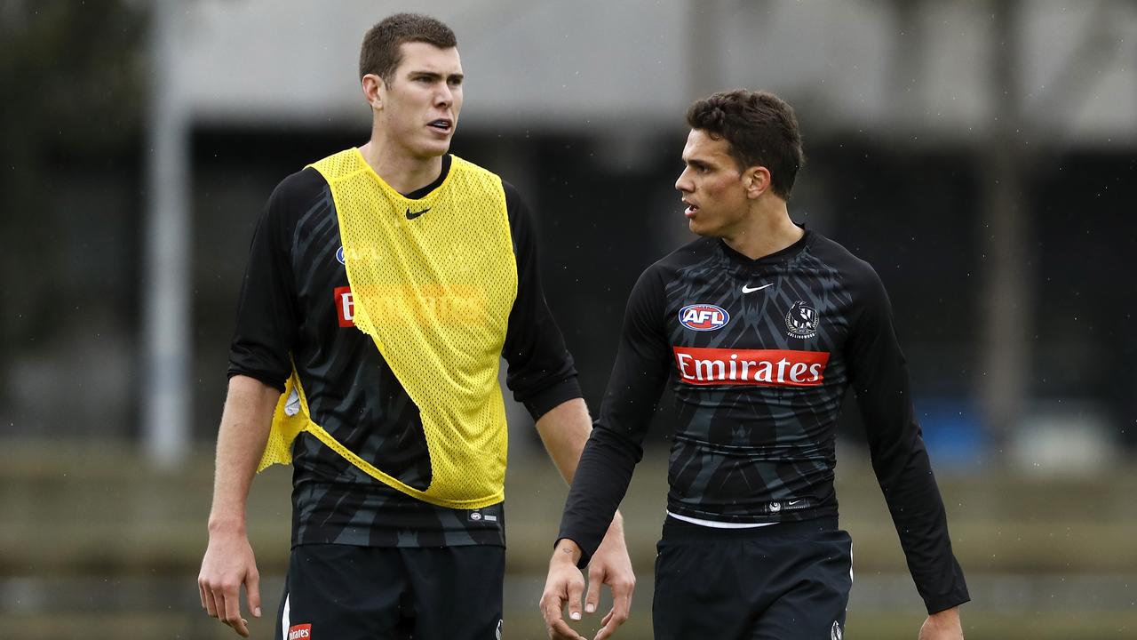 Mason Cox and Ash Johnson of the Magpies look on during the Collingwood training session. Picture: Dylan Burns/AFL Photos via Getty Images