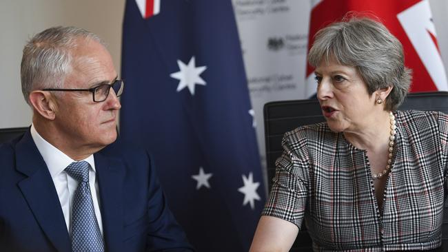 Australian Prime Minister Malcolm Turnbull (left) and British Prime Minister Theresa May speak during an Intelligence Partners meeting on the sidelines of the Commonwealth Heads of Government Meeting in London.