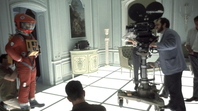 Stanley Kubrick looks through camera on set of 2001 A Space Odyssey at MGM Studios.