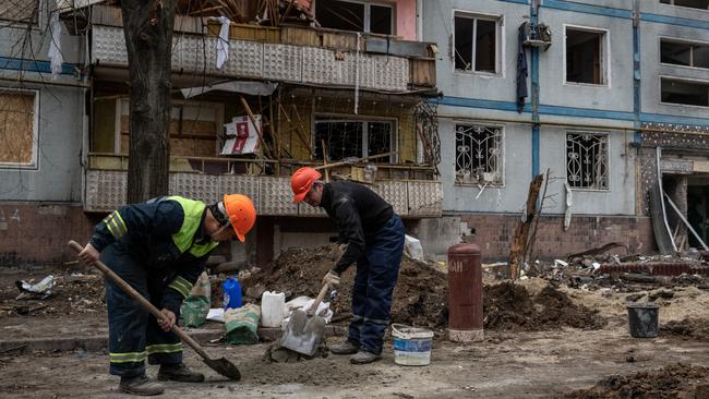 Construction workers mix cement next to an apartment block that was destroyed by a Russian missile attack earlier in the month in Zaporizhzhia oblast, Ukraine. Picture: Getty Images