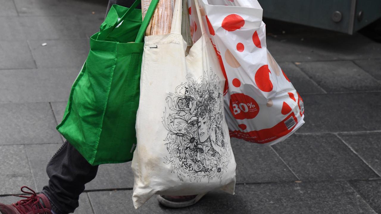 Both Coles and Woolworths committed to a June 30, 2018 deadline for removing single-use plastic bags last year. Picture: AAP Image/Peter RAE