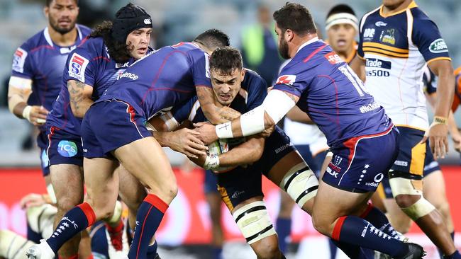 CANBERRA, AUSTRALIA - MAY 12: Rory Arnold of the Brumbies is tackled during the round 12 Super Rugby match between the Brumbies and the Rebels at GIO Stadium on May 12, 2018 in Canberra, Australia. (Photo by Mark Nolan/Getty Images)