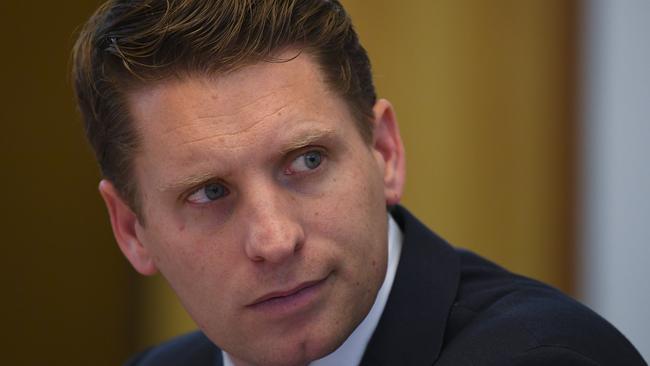 Committee chair Andrew Hastie reacts during a hearing of the Parliamentary Joint Committee on Intelligence and Security at Parliament House in Canberra, Wednesday, July 31, 2019. (AAP Image/Lukas Coch) NO ARCHIVING