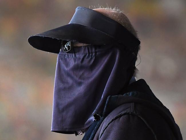 A man wears a face mask at Melbourne's Flinders Street Station. Picture: AFP