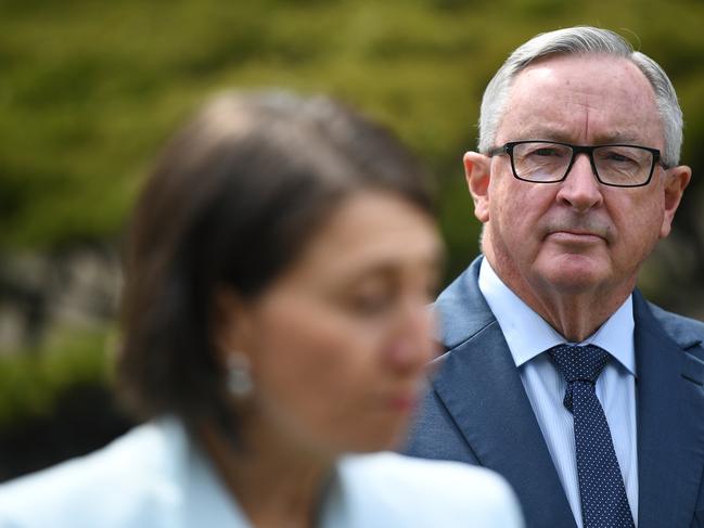 Brad Hazzard watches on as NSW Premier Gladys Berejiklian speaks to media. Picture: NCA NewsWire/Joel Carrett