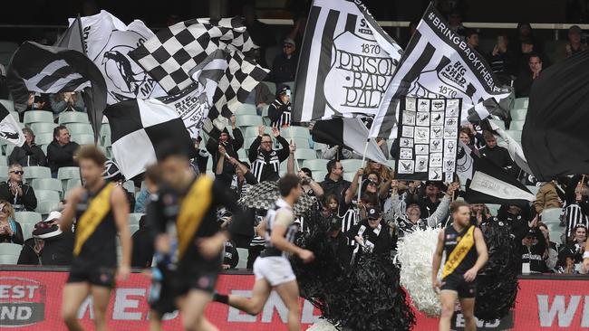 Port Adelaide fans celebrate an early goal at Adelaide Oval. Picture SARAH REED