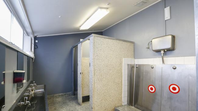 The ageing boys’ bathroom has two cubicles for more than 100 students. Picture: Valeriu Campan