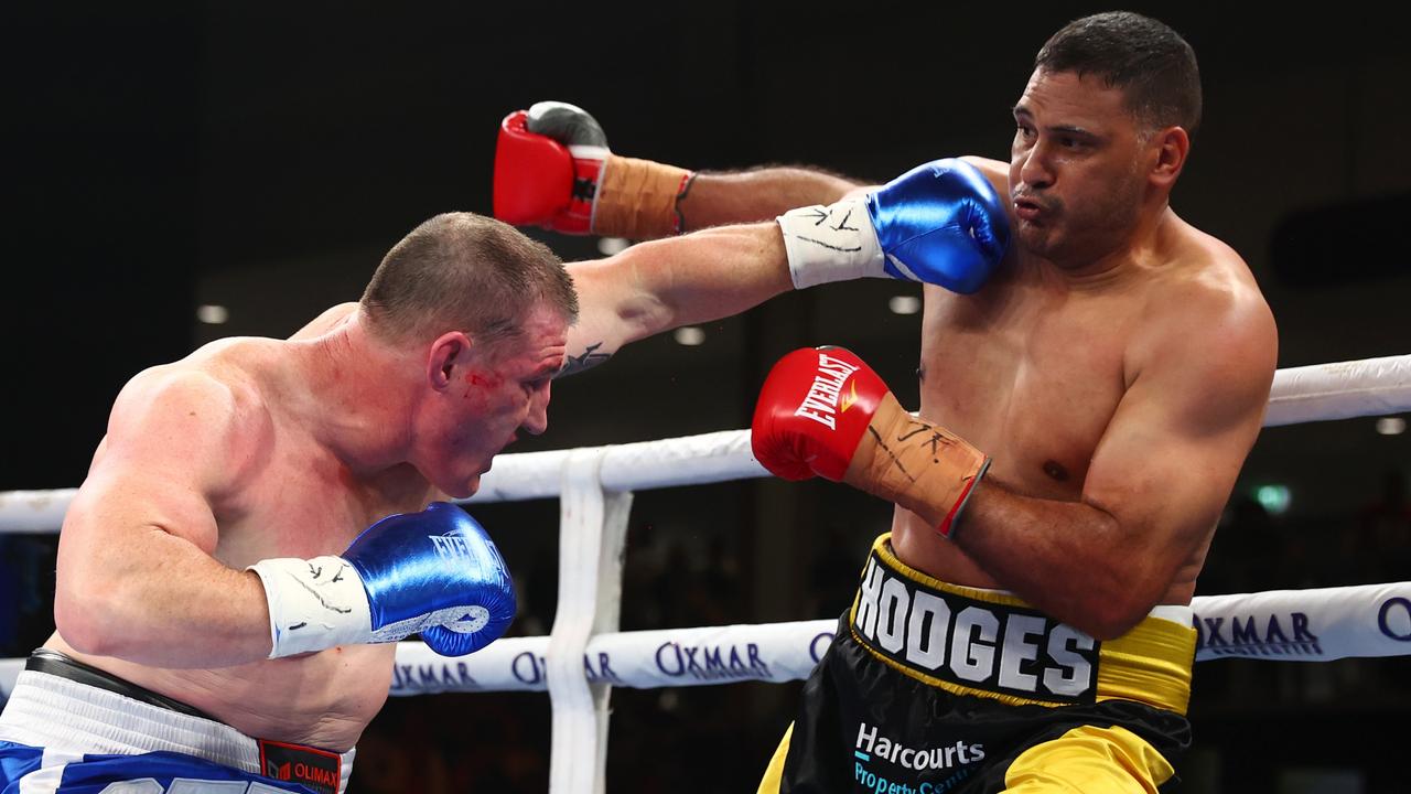 Paul Gallen and Justin Hodges exchange punches. Picture: Chris Hyde/Getty Images