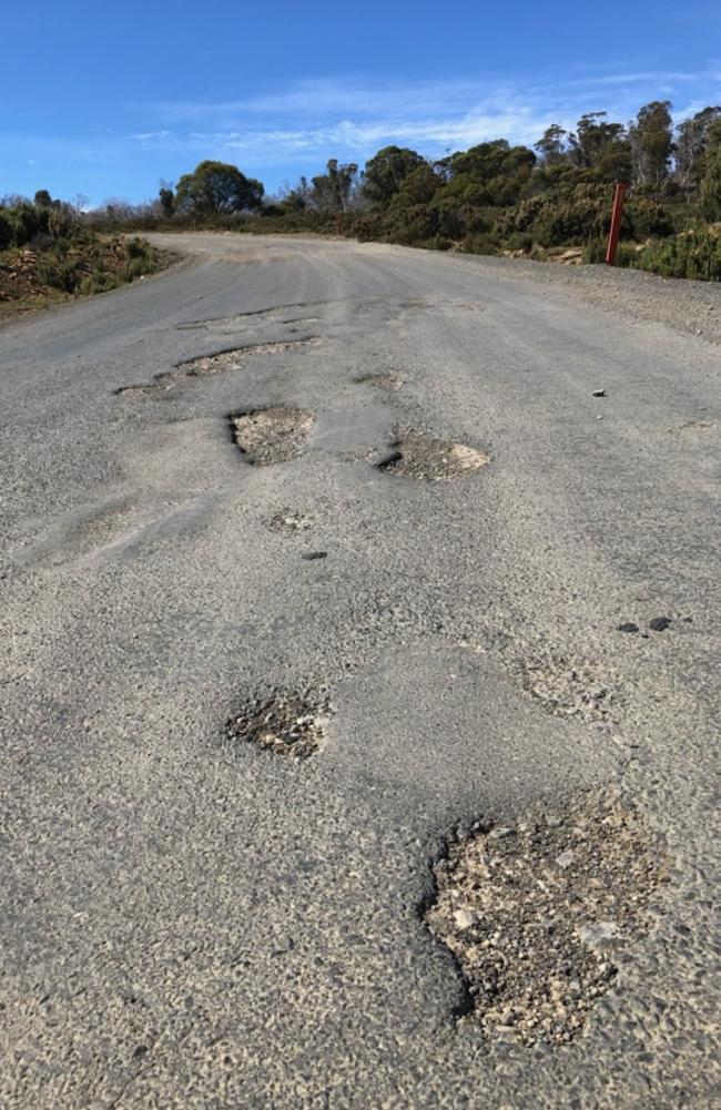 Pic of the bad state of the Marlborough Road by Wayne Turale for Charles Wooley col for the Hobart Mercury.