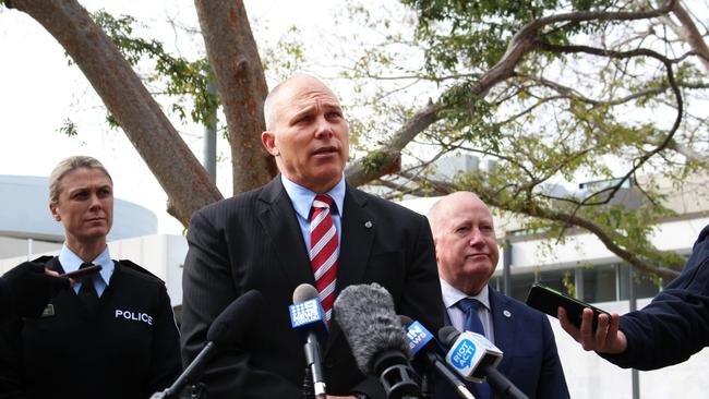 Detective Superintendent Scott Moller, centre.