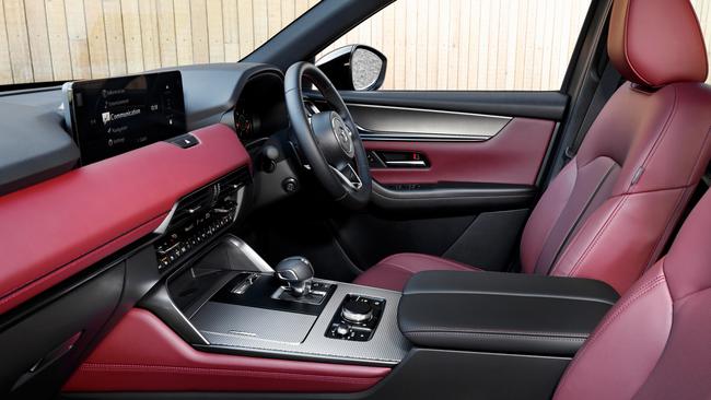 Inside the Mazda CX-70 with the optional burgundy Nappa leather seat trim.