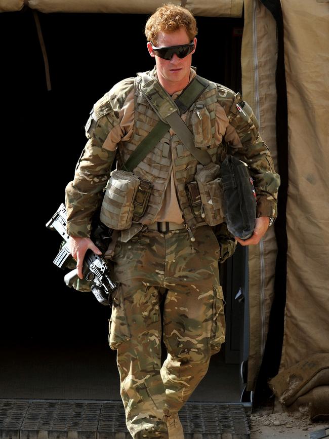 Prince Harry pictured walking out of a tent at the British controlled flight-line at Camp Bastion in Afghanistan's Helmand Province, where he was serving as an Apache Helicopter Pilot/Gunner. Picture: AFP