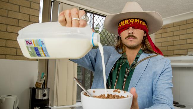 George Hunter was getting lots of feedback on Instagram for his challenges and realised it would be a good way to raise money for charity. He’s pictured at home doing the blindfolded cereal challenge. Picture: Jerad Williams