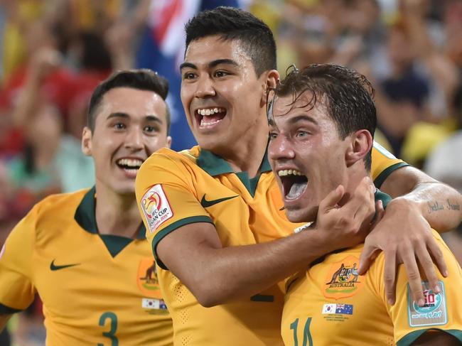 Australia's James Troisi (R) celebrates scoring with teammates Jason Davidson (L) and Massimo Luongo (C) during the AFC Asian Cup football final between South Korea and Australia at Stadium Australia in Sydney on January 31, 2015. AFP PHOTO / Peter PARKS -- IMAGE RESTRICTED TO EDITORIAL USE - STRICTLY NO COMMERCIAL USE