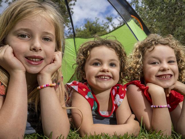 Naoise (6), Loki (3) and Tilly (6) camp in the backyard. Picture: Jake Nowakowski