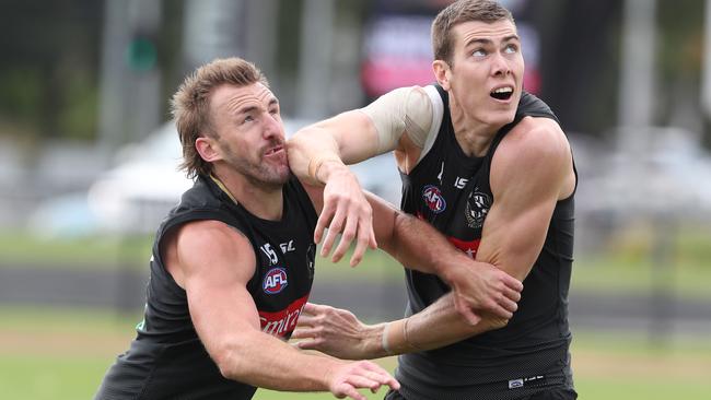 Lynden Dunn battles with Mason Cox at training. Picture: David Crosling