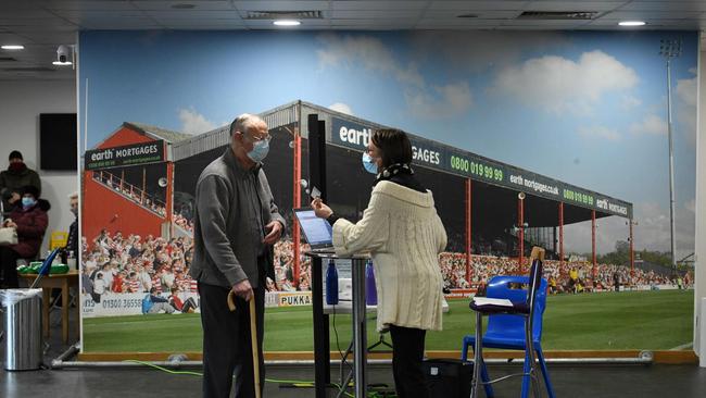 A man arrives to receive the Oxford/AstraZeneca COVID-19 vaccine at a temporary vaccination centre in northern England. Picture; AFP.