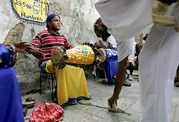 Praise be ... drummers play during a religious ceremony on a Havana street. Picture: Reuters