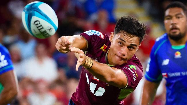 Queensland Red's Kalani Thomas makes a pass during the Super Rugby match between the Queensland Reds and Fijian Drua at Suncorp Stadium in Brisbane on March 12, 2022. (Photo by Patrick HAMILTON / AFP) / -- IMAGE RESTRICTED TO EDITORIAL USE - STRICTLY NO COMMERCIAL USE --