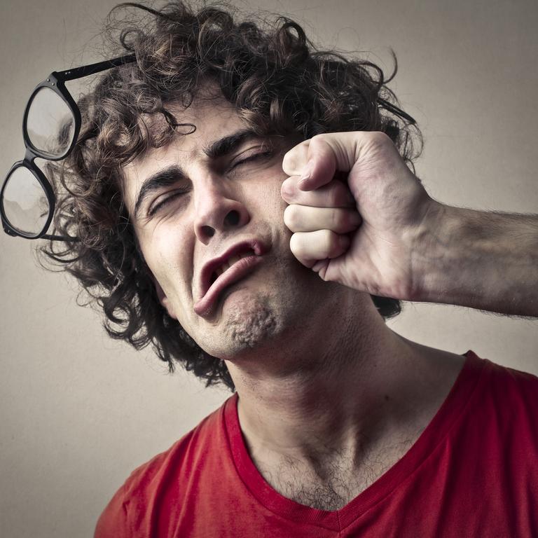 Portrait of a man who getting a punch from someone, man hit in face, punched, generic
