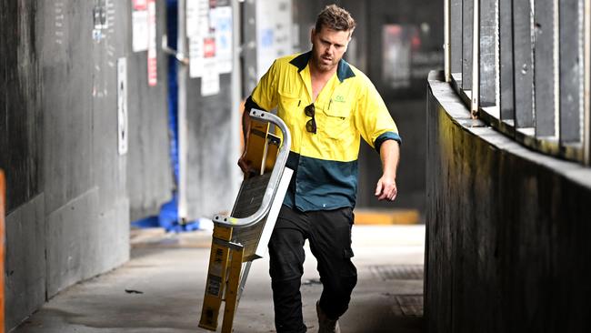 Sub-contractors and tradesmen pack up their equipment and walk off the 443 Queens Street construction site in Brisbane before Probuild collapsed. Picture: NCA NewsWire / Dan Peled