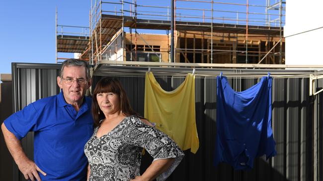 Chris and Steph Chardon are concerned about the impact a neighbouring four-storey apartment building, presently under construction, will have on their privacy and house value once completed. Picture: Naomi Jellicoe