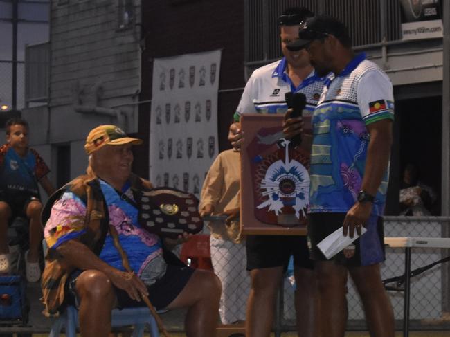 Elder Arnold Doyle (left) presenting the winner's shield at the Mackay Indigenous Rugby League Carnival. Picture: Mitch Bourke.