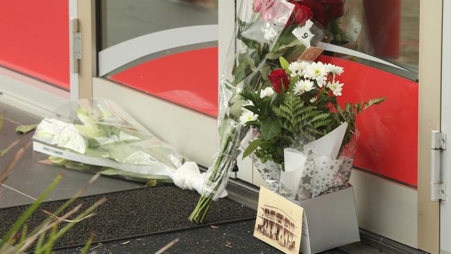 Flowers at the scene where Julie Seed was allegedly murdered in a horrific daylight stabbing attack. Picture: NCA NewsWire / Dean Martin