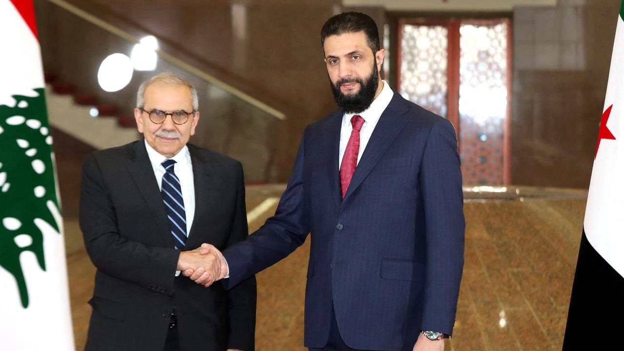Ahmed al-Sharaa (R) became Syria’s interim president after leading forces that overthrew Bashar al-Assad. A former rebel commander, he now heads a transitional government focused on restoring state institutions and promoting national reconciliation. His leadership marks a dramatic shift from authoritarian rule toward a new political era in Syria. Picture: AFP