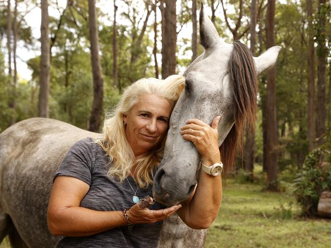 Natalie Skillings-Smith from Woodburn with one of her surviving horses, Centaur. Picture: Jonathan Ng