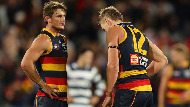 ADELAIDE, AUSTRALIA - MARCH 22: Matt Crouch ad Jordan Dawson of the Crows after the loss during the 2024 AFL Round 2 match between the Adelaide Crows and the Geelong Cats at Adelaide Oval on March 22, 2024 in Adelaide, Australia. (Photo by Sarah Reed/AFL Photos via Getty Images)