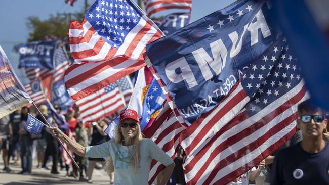 Trump supporters give the ex-president a warm welcome as he drives near his Mar-a-Lago home in West Palm Beach. Picture: AFP