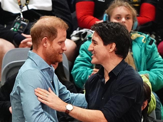 The Duke of Sussex speaks with Canadian Prime Minister Justin Trudeau as they watch the Indoor Rowing at the Vancouver Convention Centre at the tail end of the Invictus Games. Picture: PA Images via Getty Images