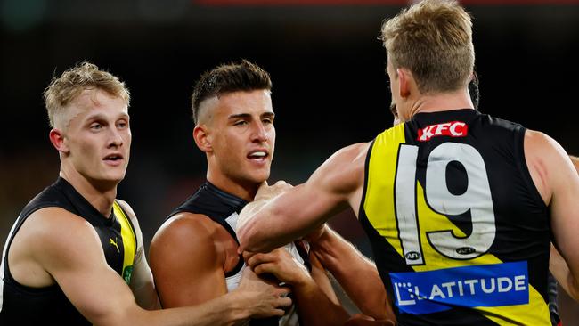 MELBOURNE, AUSTRALIA - MARCH 31: Nick Daicos of the Magpies remonstrates with Tom Lynch of the Tigers during the 2023 AFL Round 03 match between the Collingwood Magpies and the Richmond Tigers at the Melbourne Cricket Ground on March 31, 2023 in Melbourne, Australia. (Photo by Dylan Burns/AFL Photos via Getty Images)