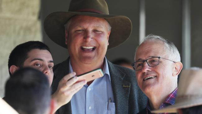 Prime Minister Malcolm Turnbull and Trevor Ruthenberg with a supporter at Caboolture today. Picture: Annette Dew