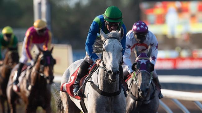 The 2020 Darwin Cup race, with winner Ihtsahymn ridden by jockey Peter Hall in the lead. Picture: Che Chorley