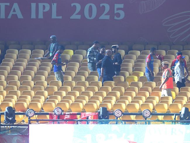 Spectators leave the stands after authorities evacuated the stadium during the clash between Punjab Kings and Delhi Capitals. Picture: Getty