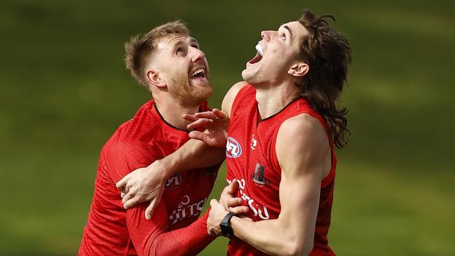 Sam Durham and Essendon captain Dyson Heppell. Picture: Darrian Traynor/Getty Images