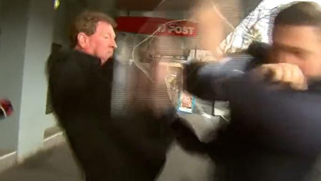 Ricky Nixon and TV reporter Seb Costello in an ugly confrontation on the streets of Port Melbourne. Picture: Channel 9