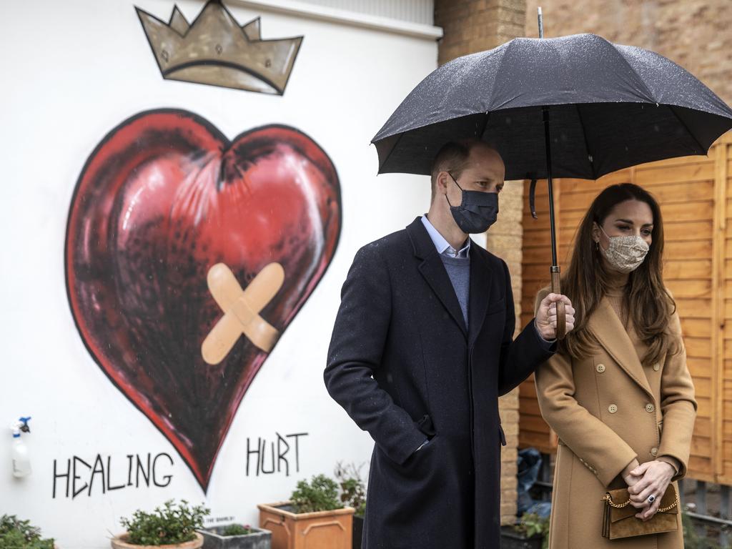 The royal couple posed in front of a ‘healing hurt’ mural. Picture: Getty Images