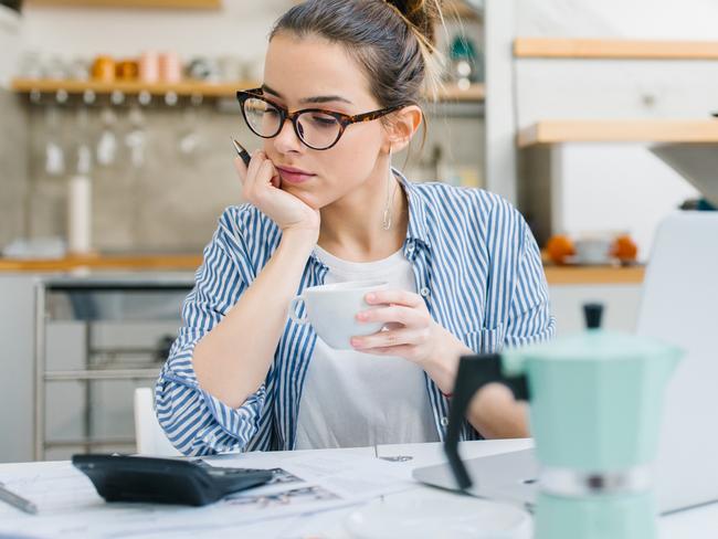 MONEY ISTOCK -  Young women doing paper work at home Picture: Istock