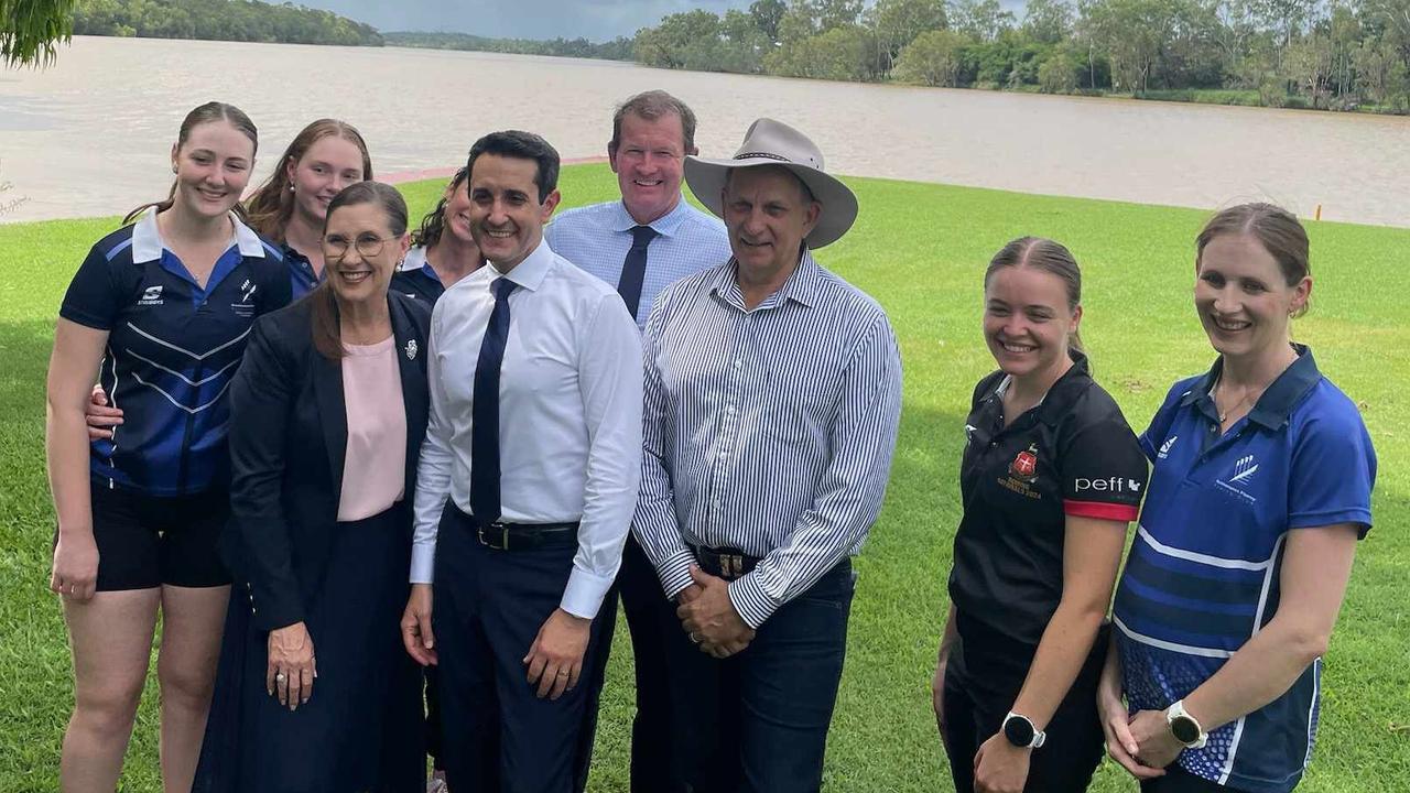 Rockhampton MP Donna Kirkland, Premier David Crisafulli, Mirani MP Glen Kelly and Rockhampton Mayor Tony Williams with Rockhampton Fitzroy Rowing Club members and Rockhampton Fitzroy Rowing Club president Sarah Black (far right) on the banks of the Fitzroy River.