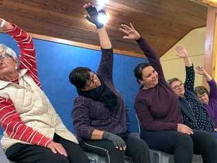 CLASS IN SESSION: Megan Brown (centre) leads her popular seated yoga class for Roma U3A. Picture: Jorja McDonnell