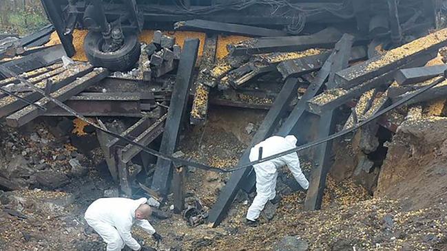 Investigators comb the site of a missile strike in the southeastern Polish village of Przewodow, 6km from the Ukrainian border. Picture: AFP